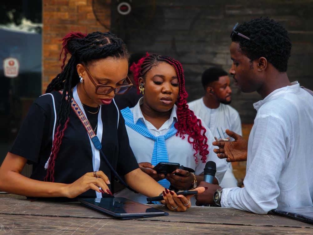 Stephanie and crew members working through the event flow on a tablet.