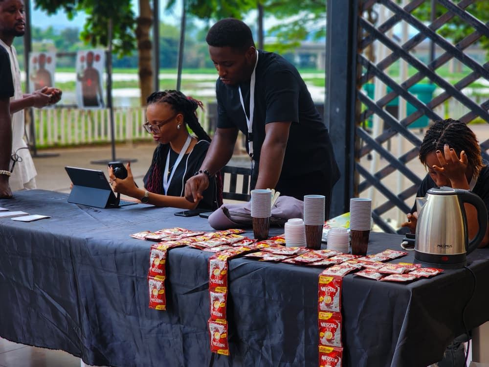 Registration table with cups, tablets and crew.
